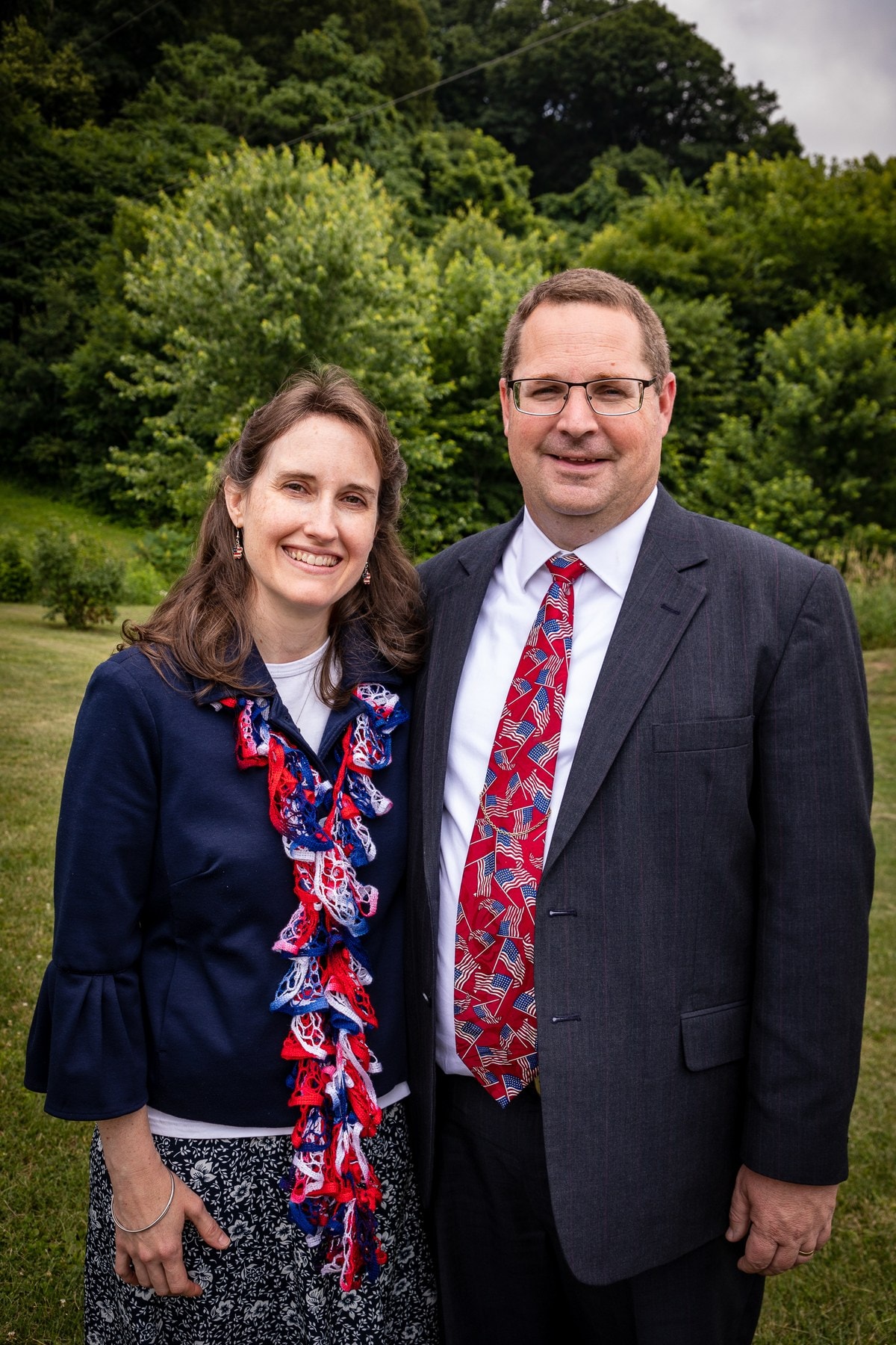 Pastor Paul Harvey and his wife Joanna standing together outdoors.